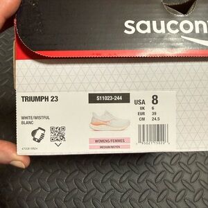 Saucony Running Shoes with White and Orange Accents